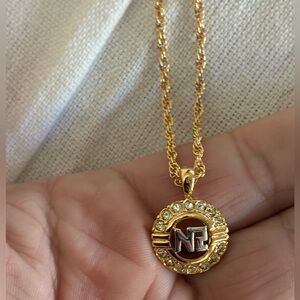 Nina Ricci Gold-tone Logo Pendant Necklace with Clear Stones